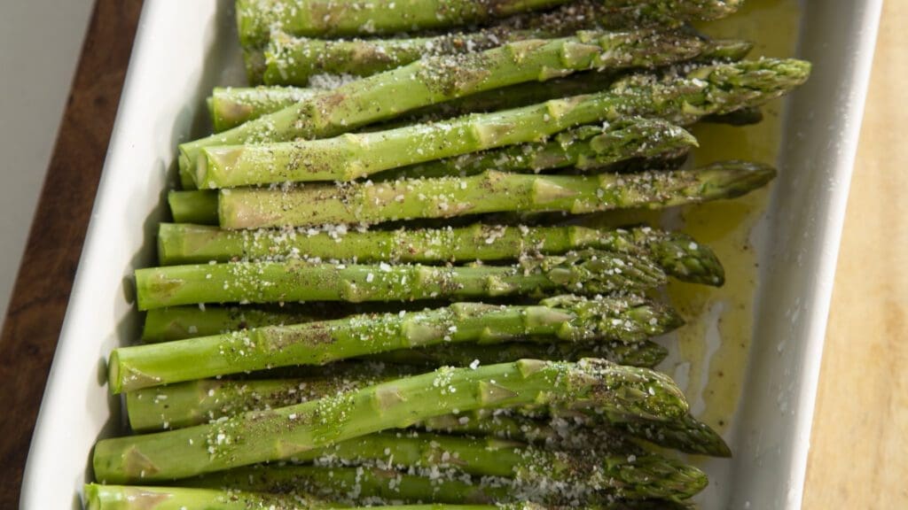 Evenly Coat Asparagus with olive oil salt and pepper